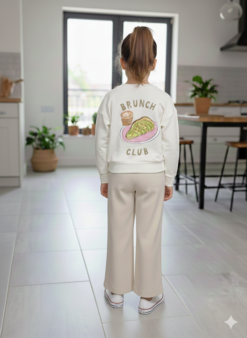 Pantalon beige fille coupe large avec taille élastique et bouton